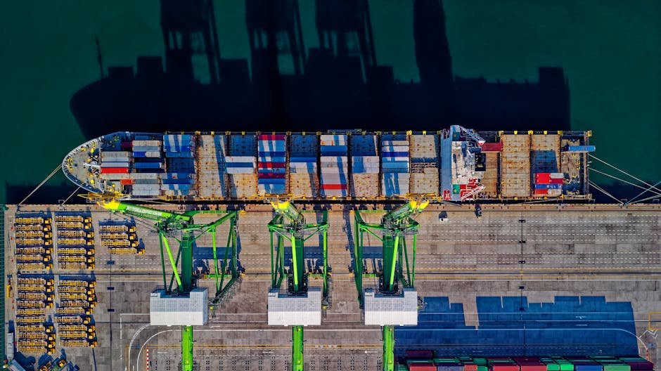 pexels-photo-1554646-1554646 High angle aerial view of a cargo ship at a bustling port in Jakarta, showcasing global trade.
