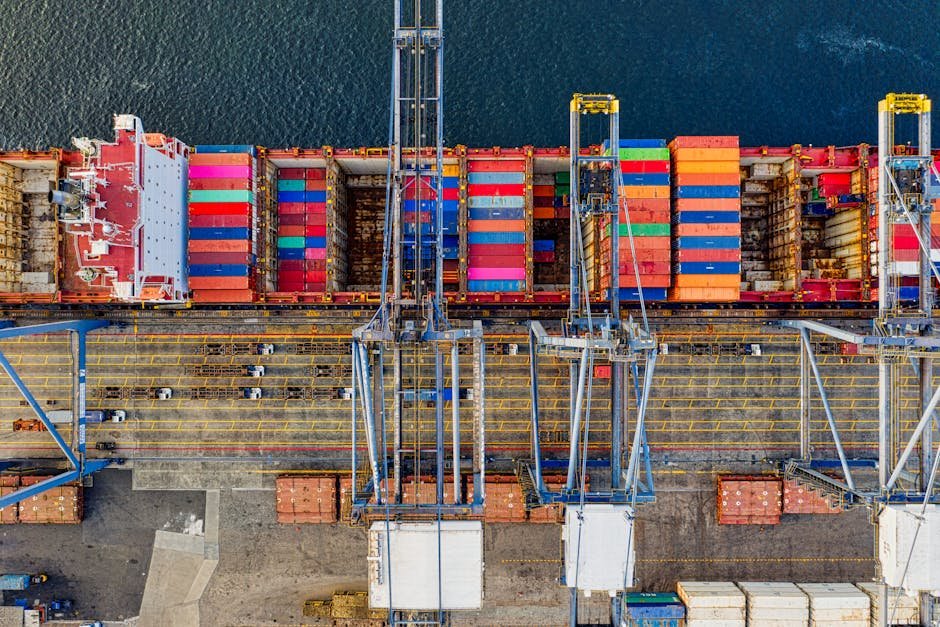 pexels-photo-3057963-3057963 Aerial view of colorful cargo containers at a bustling port in Jakarta, Indonesia.
